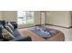Cozy living room featuring stylish sofa, decorative pillows, and a large window at 5027 E 40Th St, Indianapolis, IN 46226