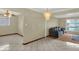 Spacious living area with abundant natural light, decorative chandelier, and neutral color palette at 5027 E 40Th St, Indianapolis, IN 46226