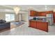 Bright and open living space featuring a kitchen area, large windows, and decorative lighting at 5027 E 40Th St, Indianapolis, IN 46226