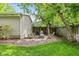 Backyard features a brick patio and four Adirondack chairs at 5526 Indianola Ave, Indianapolis, IN 46220