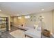 Finished basement provides a large seating area with light gray sofa at 5526 Indianola Ave, Indianapolis, IN 46220