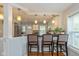 Eat-in kitchen with pendant lighting, bar stool seating, and direct access to the Living Room at 5526 Indianola Ave, Indianapolis, IN 46220
