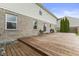 An elevated wood deck connected to the home's brick and siding exterior with window access at 5851 Grand Ave, Plainfield, IN 46168