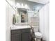 Updated bathroom features a modern vanity, stylish mirror, and shower-tub combination at 5851 Grand Ave, Plainfield, IN 46168