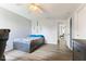 Bright bedroom with wood floor, overhead lighting, gray walls, and storage bed at 5851 Grand Ave, Plainfield, IN 46168