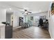 Bright dining area featuring a ceiling fan, large windows, and versatile space for dining or home office at 5851 Grand Ave, Plainfield, IN 46168