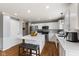 Modern kitchen featuring white cabinetry, stainless steel appliances, and a large center island at 5851 Grand Ave, Plainfield, IN 46168