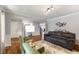 Spacious living area with modern decor, a cozy seating arrangement, and hardwood flooring at 5851 Grand Ave, Plainfield, IN 46168