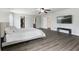 Spacious main bedroom with wood floors, closet and ensuite bath access, and a mounted television at 5851 Grand Ave, Plainfield, IN 46168