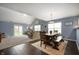 Open-concept layout with dining area connecting living room and kitchen at 610 Redwood Dr, Pendleton, IN 46064