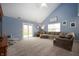 Spacious living room featuring vaulted ceilings and a comfortable sectional sofa at 610 Redwood Dr, Pendleton, IN 46064