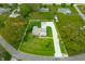 Expansive aerial view of property with a long driveway, mature trees, and 0.49 +/- acres of land at 6250 Seminole Dr, Indianapolis, IN 46259
