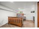 Finished basement bedroom featuring wood flooring, natural light, and ample space at 6250 Seminole Dr, Indianapolis, IN 46259