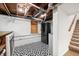 Finished basement with black stainless steel refrigerator and stylish tile flooring at 6250 Seminole Dr, Indianapolis, IN 46259
