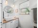 Elegant bathroom with wood counters, updated lighting, and modern fixtures at 6250 Seminole Dr, Indianapolis, IN 46259