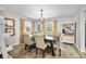 Bright dining area featuring a wooden table, comfortable seating, and decorative accents at 6250 Seminole Dr, Indianapolis, IN 46259