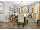 Inviting dining room with stylish chandelier, elegant furniture, and ample natural light at 6250 Seminole Dr, Indianapolis, IN 46259
