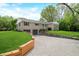Exterior elevation of a home with stone and gravel driveway at 6250 Seminole Dr, Indianapolis, IN 46259