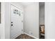 Bright foyer with a bench and decorative door, creating a welcoming entrance into the home at 6250 Seminole Dr, Indianapolis, IN 46259