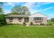 Charming stone home with a well-manicured lawn and inviting front entrance, perfect for curb appeal at 6250 Seminole Dr, Indianapolis, IN 46259