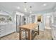 Bright kitchen with stainless steel refrigerator, kitchen island, and tiled floor at 6250 Seminole Dr, Indianapolis, IN 46259