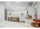 Well-equipped kitchen with white cabinets, marble countertops, and a breakfast bar area at 6250 Seminole Dr, Indianapolis, IN 46259