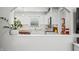 Well-lit kitchen with white cabinetry, marble countertops, subway tile backsplash, and modern appliances at 6250 Seminole Dr, Indianapolis, IN 46259