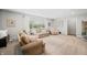 Bright living room featuring neutral decor, plush seating, and large windows for natural light at 6250 Seminole Dr, Indianapolis, IN 46259