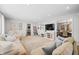 Spacious living room with open layout, neutral color scheme, and seamless transition to the kitchen and dining areas at 6250 Seminole Dr, Indianapolis, IN 46259
