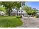 Expansive backyard featuring a fire pit, colorful Adirondack chairs, and mature trees at 6288 Buttonwood Dr, Noblesville, IN 46062
