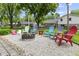 Backyard firepit area with colorful Adirondack chairs at 6288 Buttonwood Dr, Noblesville, IN 46062