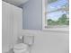 Bright bathroom featuring a toilet, shower, and window bringing in natural light at 6288 Buttonwood Dr, Noblesville, IN 46062