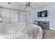 Bright bedroom featuring a ceiling fan, carpet, and closets at 6288 Buttonwood Dr, Noblesville, IN 46062