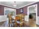 Spacious dining room with wooden table set for six, featuring modern lighting at 6288 Buttonwood Dr, Noblesville, IN 46062