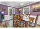 Well-lit dining room with wood floors and table, perfect for Gathering gatherings and entertaining at 6288 Buttonwood Dr, Noblesville, IN 46062