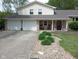 Beautiful home featuring a stone facade, a two-car garage, and a well-manicured front yard at 6288 Buttonwood Dr, Noblesville, IN 46062