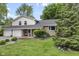 Charming home featuring a stone facade, a two-car garage, a landscaped yard, and mature trees at 6288 Buttonwood Dr, Noblesville, IN 46062