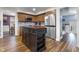 Modern kitchen with stainless steel appliances, a center island, and wood-look flooring at 6288 Buttonwood Dr, Noblesville, IN 46062
