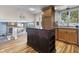 Open kitchen with a central island, stainless steel appliances, and wood floors at 6288 Buttonwood Dr, Noblesville, IN 46062