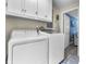 Spacious laundry area with modern appliances and overhead cabinets for storage at 6288 Buttonwood Dr, Noblesville, IN 46062