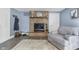 Charming living room with brick fireplace, updated flooring, and a cozy atmosphere at 6288 Buttonwood Dr, Noblesville, IN 46062