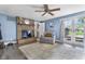 Inviting living room features a brick fireplace, French doors, and neutral color scheme at 6288 Buttonwood Dr, Noblesville, IN 46062
