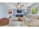Comfortable living room featuring a ceiling fan, soft couch, and a flat screen television at 6288 Buttonwood Dr, Noblesville, IN 46062