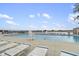 Community pool with ample lounge chairs, a lifeguard station, and lake views at 6288 Buttonwood Dr, Noblesville, IN 46062