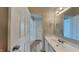 Bright bathroom with a white vanity, framed mirror, and open doorway to the hallway, maximizing light at 7018 Mallard Way, Plainfield, IN 46168