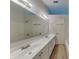 Well-lit bathroom with a double sink vanity, sleek fixtures, and a large mirror at 7018 Mallard Way, Plainfield, IN 46168