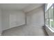 Bright bedroom featuring neutral walls, plush carpet, and a large window that provides plenty of natural light at 7018 Mallard Way, Plainfield, IN 46168