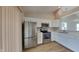 Updated kitchen with stainless steel appliances and white cabinets, offering plenty of countertop space at 7018 Mallard Way, Plainfield, IN 46168