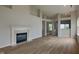 Spacious living room with hardwood floors, a cozy fireplace, and an open floor plan at 7018 Mallard Way, Plainfield, IN 46168
