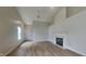 Inviting living room with fireplace, high ceilings, and natural light flowing through the front door at 7018 Mallard Way, Plainfield, IN 46168